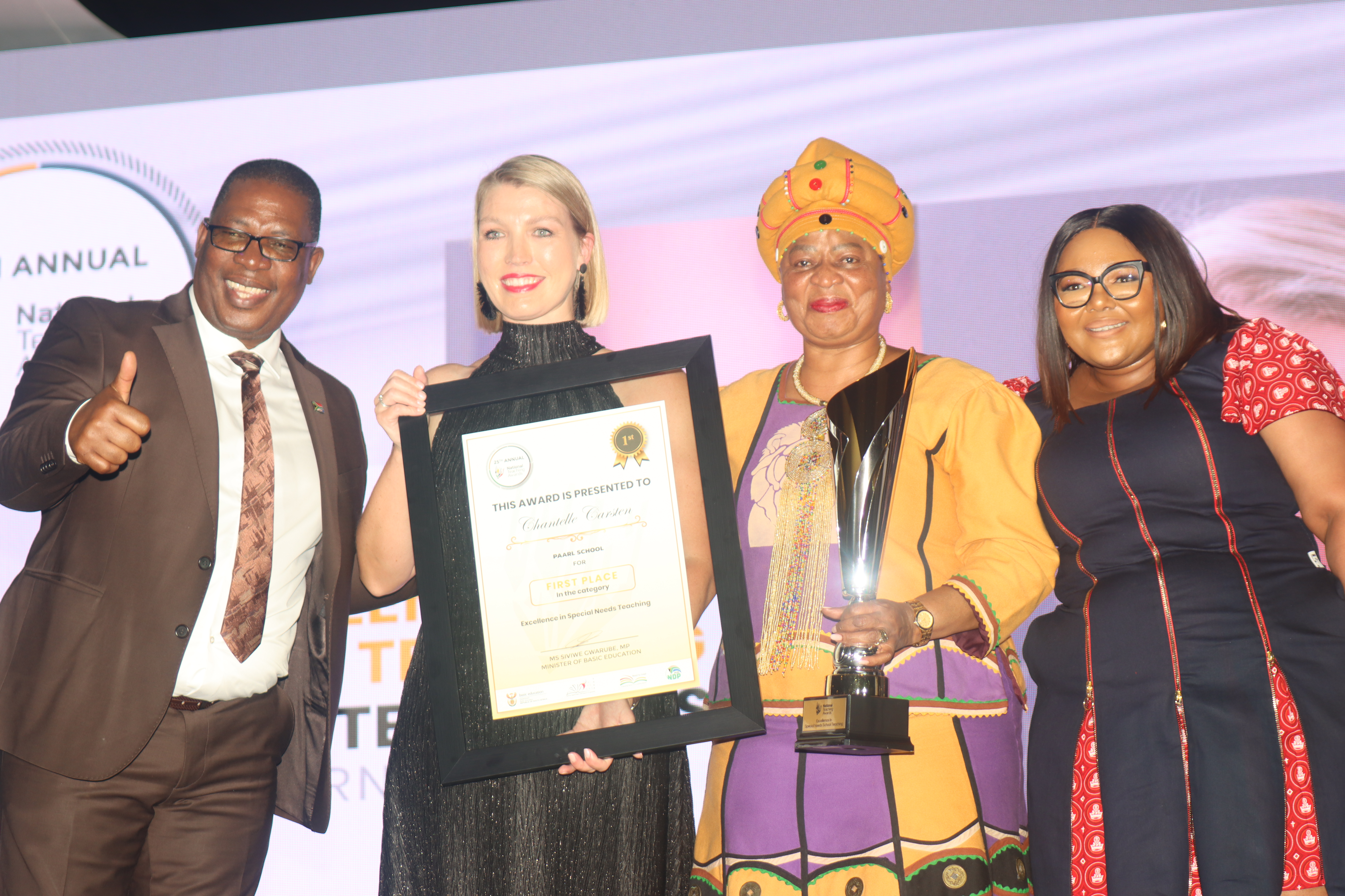 The 2025 National Teacher Award winner for Excellence in Special Needs Education, Chantelle Carstens with Gauteng Premier Panyaza Lesufi and Minister of Basic Education Siviwe Gwarube.
